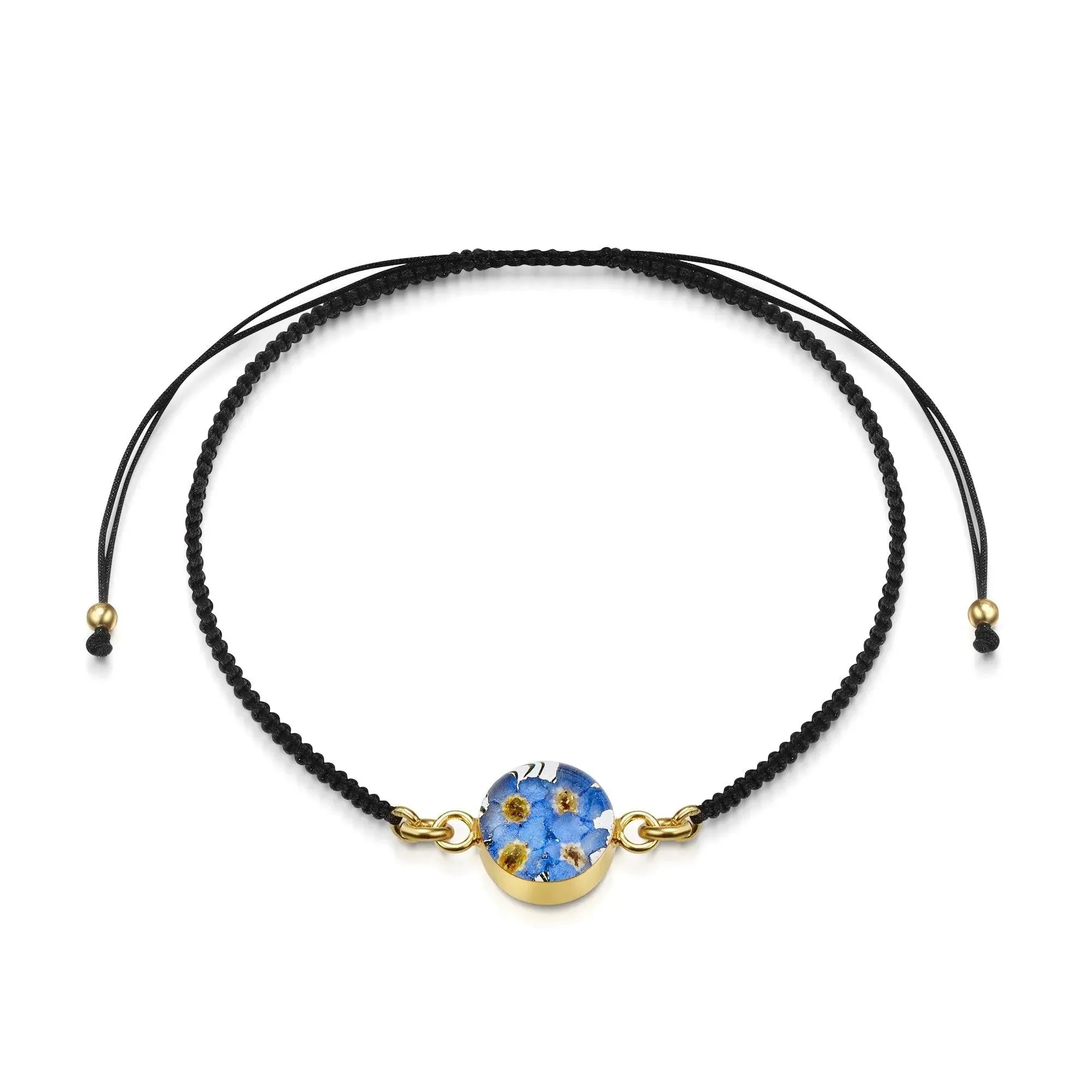 Flower bracelet | Black woven bracelet with gold-plated flower charm by Shrieking Violet®