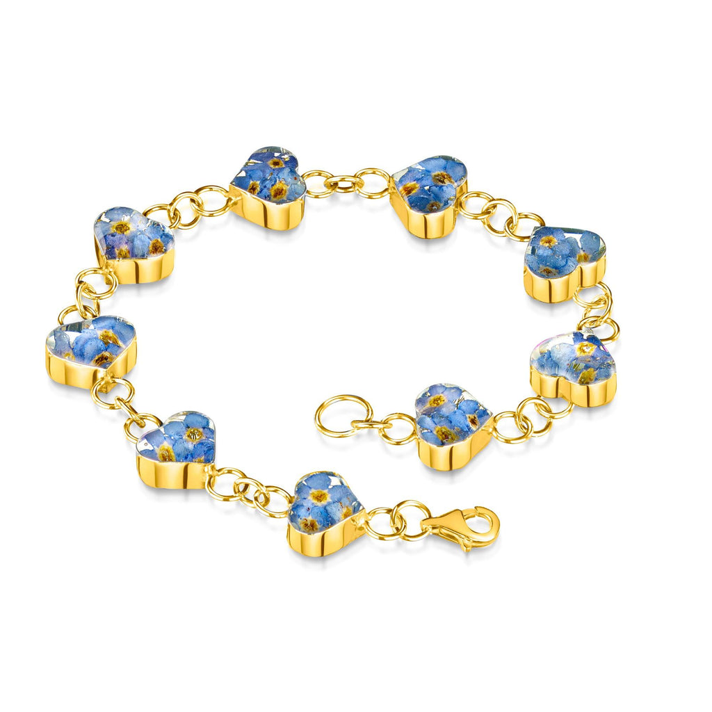 Forget me not bracelet by Shrieking Violet® Gold-plated Sterling silver heart links with real forget me not flowers. Handmade award-winning jewellery
