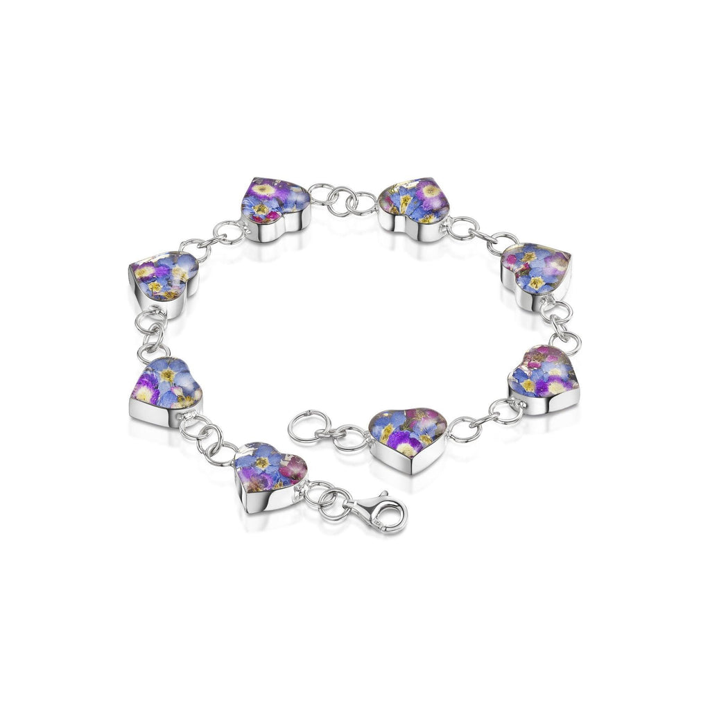 Sterling silver bracelet. Heart shapes filled with tiny purple flowers.