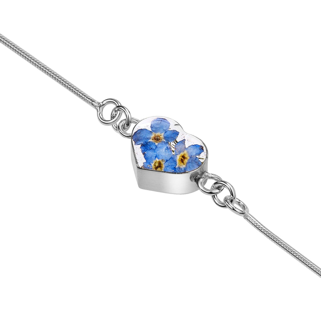 Sterling silver snake chain bracelet with a handmade charm with real forget-me-not flowers set into resin.